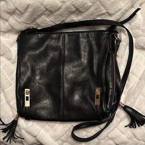 MMS Design Studio Black Crossbody Bag with Gold Accents.